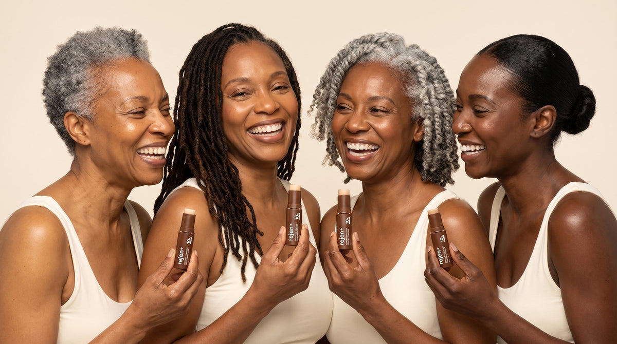 Four women from golden to ebony holding the rejen+ stick